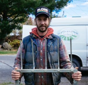 JM Fortier with his farm's namesake, the broad fork.